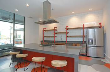 Public Kitchen With Island Dining at Link Apartments Innovation Quarter, North Carolina